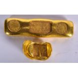 TWO CHINESE YELLOW METAL INGOTS. Largest 10 cm wide. (2)