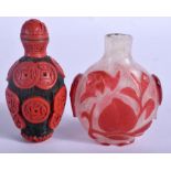 A 19TH CENTURY CHINESE PEKING GLASS SNUFF BOTTLE together with another bottle. 7.25 cm high. (2)