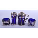 A NEO CLASSICAL FOUR PIECE SILVER CRUET SET. (4)