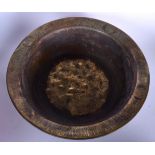 A HUGE ISLAMIC BRASS BASIN, decorated with a central mythical creature and symbols. 15 cm x 43 cm.