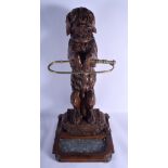 A LARGE 19TH CENTURY BAVARIAN BLACK FOREST CARVED WOOD STICK STAND modelled as a begging hound, sta