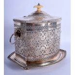 A 19TH CENTURY SILVER PLATED AND IVORY BISCUIT BOX AND COVER decorated with foliage. 20 cm x 21 cm.