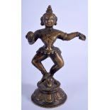 AN 18TH/19TH CENTURY INDIAN BRONZE BUDDHISTIC DEITY modelled dancing. 21 cm high.