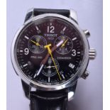 A TISSOT BLACK TRIPLE DIAL WRISTWATCH. 4 cm wide.