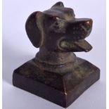 A CHINESE BRONZE SEAL, the terminal in the form of a dog head. 4.25 cm high.