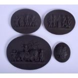 A RARE SET OF FOUR WEDGWOOD STYLE BLACK BASALT PORCELAIN PLAQUES by Elliott, decorated with classic