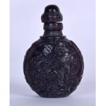 AN EARLY 20TH CENTURY CHINESE BUFFALO HORN SNUFF BOTTLE, carved with roaming horses in a landscape,