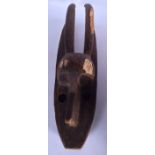 A CONGOLOESE GIPHOGO MASK, formed with elongated features. 59 cm long.