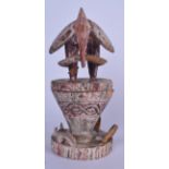 A SENUFO POLYCHROMED OINTMENT JAR, the finial in the form of a standing bird. 33 cm high.