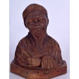 A CHINESE CARVED BUST OF AN ELDERLY MALE, formed with a scroll in his hand upon an octagonal base.