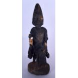 A NIGERIAN YORUBA CARVED WOODEN STATUE, formed as a figure seated upon the back of a horse. 53 cm h