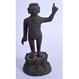 A RARE 17TH CENTURY CHINESE BRONZE FIGURE OF A BOY Ming, possibly a representation of Shakayamuni.