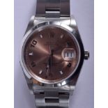 A BOXED ROLEX OYSTER PERPETUAL DATE STAINLESS STEEL WRISTWATCH Full Set with papers and rusty peach