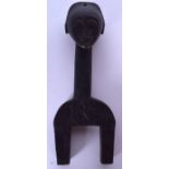 AN IVORY COAST YOHURE WOODEN HEDDLE PULLEY, carved with animals. 21 cm x 8 cm.
