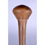 AN AFRICAN WOODEN THROWING CLUB, formed with bulbous terminal. 42 cm long.