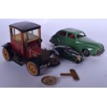 A VINTAGE SCHUCO CLOCKWORK TOY CAR, together with another and a Chad Valley example. Largest 19 cm