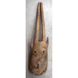 A MALIAN DOGON GIPHOGO WOODEN MASK, carved with elongated horns. 84 cm long.