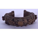 AN IVORY COAST BAOULE BRONZE BANGLE, formed with rope twist decoration. 9 cm wide.