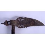 A 19TH CENTURY MIDDLE EASTERN PERSIAN IRON AXE upon a wooden shaft. 62 cm x 24 cm.