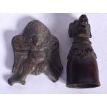 A TIBETAN BRONZE PLAQUE, together with a dog cup. Plaque 6 cm. (2)