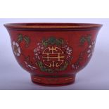 A CHINESE RED GLAZED [PORCELAIN BOWL, painted with foliage. 12 cm wide.