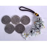 A FIVE CHINESE WHITE METAL COINS, together with a jadeite hanging group. (6)