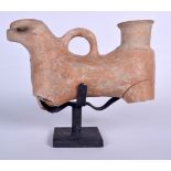 A PERSIAN POTTERY JUG IN THE FORM OF A BULL, together with fitted stand. Figure 26 cm wide.