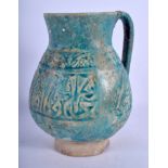 A 12TH/13TH CENTURY KASHAN TURQUOISE MOULDED JUG Persia, decorated with scrolling motifs. 17 cm hig