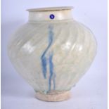 A RARE 12TH/13TH CENTURY KASHAN SPIRALLY MOULDED VASE Persia, painted with blue streaks. 18 cm high