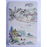 A CHINESE REPUBLICAN PERIOD FAMILLE ROSE TILE painted with figures within landscapes. 25 cm x38 cm.
