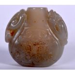 A CHINESE JADE SNUFF BOTTLE, carved with dragon handles. 4.75 cm x 5 cm.