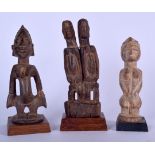 A MALIAN BAMBARA DOGON TRIBE WOODEN STATUE, together with two other carvings. Largest 26 cm. (3)