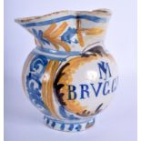 A 19TH CENTURY ITALIAN FAIENCE MAJOLICA TIN GLAZED JUG painted with scripture. 16 cm x 14 cm.