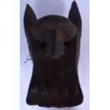 A WEST AFRICAN ZOOMORPHIC WOODEN MASK, formed with a raised forehead. 41 cm x 22 cm.