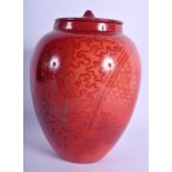 A BERNARD MOORE FLAMBE VASE AND COVER in the manner of Charles Noke. 19 cm high.