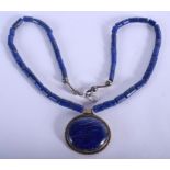 A MIDDLE EASTERN CARVED LAPIS LAZULI NECKLACE. 34 cm long.