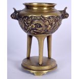 A CHINESE QING DYNASTY BRONZE TRI LEGGED CENSER, decorated with a dragon amongst the clouds. 13 cm