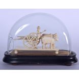 AN EARLY 20TH CENTURY INDIAN IVORY FIGURES, forming a male upon an ox driven cart. Case 16 cm x 20