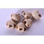 SIX CARVED STONE SKULL BEADS. 1.5 cm. (6)