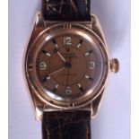 A RARE ART DECO 14CT GOLD ROLEX OYSTER BUBBLE BACK WRISTWATCH with peach dial and two tone numerals