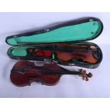 A VINTAGE TWO PIECE BACK VIOLIN together with another within a case. 64 cm long. (3)