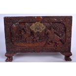 A MID 20TH CENTURY CHINESE CAMPHORWOOD CHEST, carved with figures in landscapes. 25 cm x 36 cm.