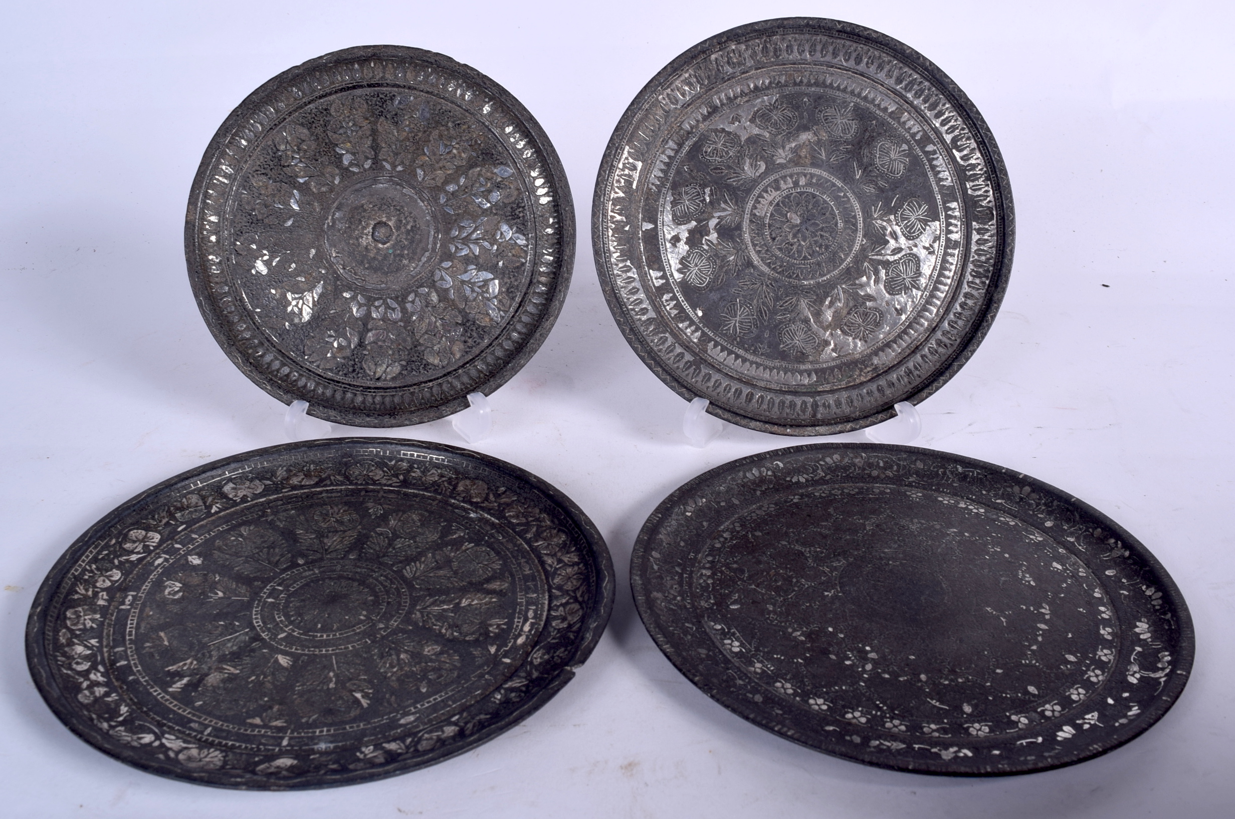 FOUR EARLY 20TH CENTURY INDIAN BIDRI INLAID DISH, decorated with foliage. 17.5 cm wide. (4)