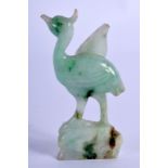 A SMALL EARLY 20TH CENTURY CHINESE CARVED JADEITE FIGURE OF A BIRD modelled upon a rocky outcrop. 6
