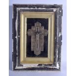 AN ANTIQUE CONTINENTAL SILVER PLATED CRUCIFIX within an ebonised frame. Cross 18 cm x 6 cm.