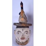 A NIGERIAN YORUBA WOODEN POLYCHROMED GELEDE MASK, formed with an a chicken finial. 52 cm x 26 cm.