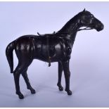 A VINTAGE LEATHER HORSE, modelled standing. 32 cm x 32 cm.