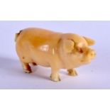 AN ANTIQUE CARVED IVORY PIG. 4.5 cm wide.