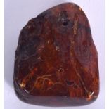 AN AMBER BOULDER, weight 26 grams. 4.5 cm x 4.25 cm.