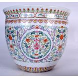 A LARGE CHINESE DOUCAI PORCELAIN JARDINIERE, painted with extensive foliage. 36 cm x 42 cm.